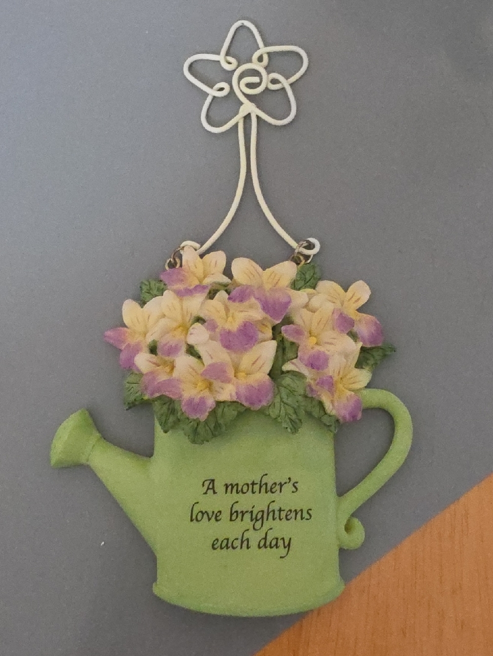This is a Russ  Ceramic floral watering can message ornament.
